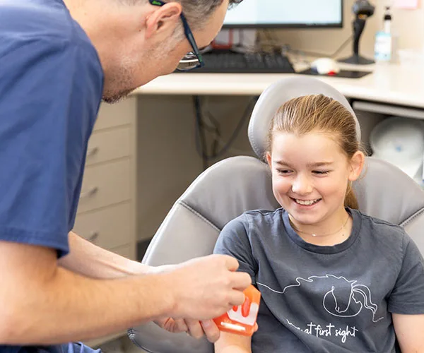 A dental examination image from the client’s Child Dental Benefit Scheme page