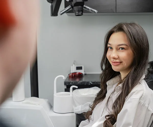 A patient seated for a dental visit, from the client’s jaw muscle service page