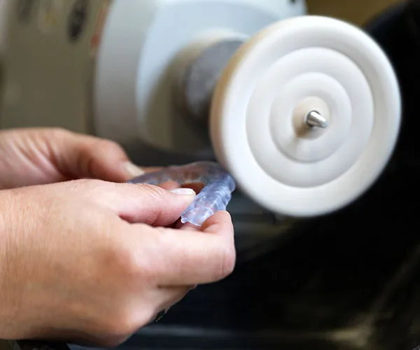 A dental appliance being finished, from the client’s night guards page